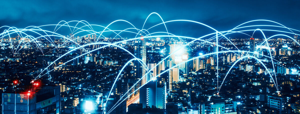 Digital cityscape with interconnected energy networks and green energy icons.
