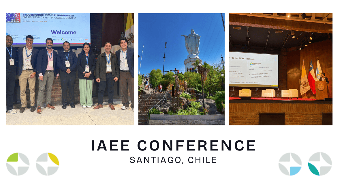 Participants at IAEE Conference in Santiago, Chile, with city landmark and stage.