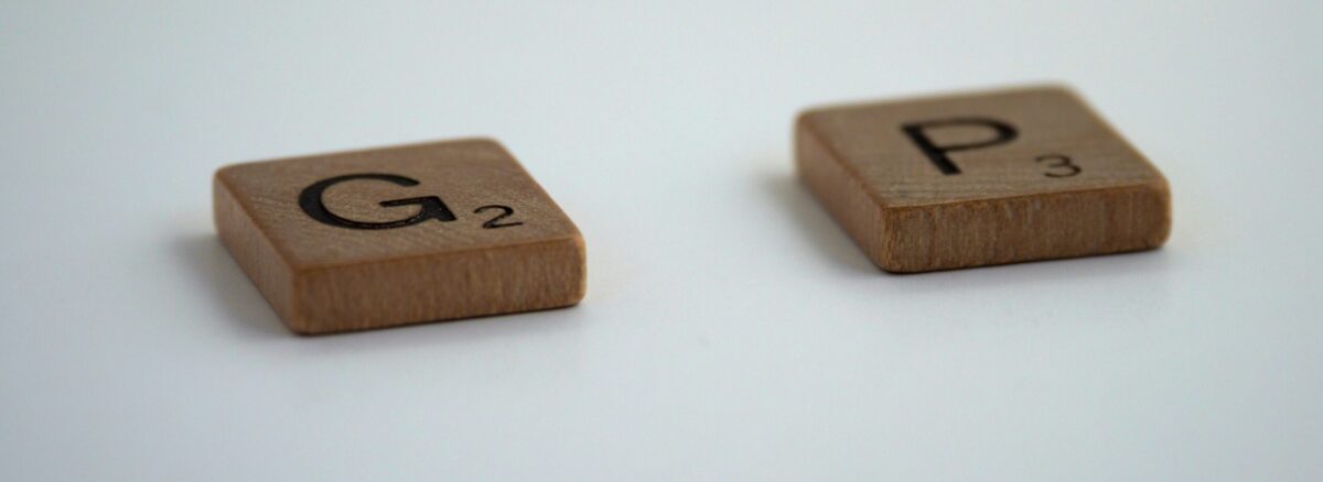 Two scrabble pieces on a white background. One 'G' square and one 'P' square with a gap in the middle where an 'A' would go.