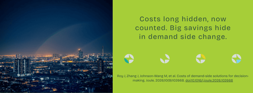 City skyline at night with demand-side change message overlay.