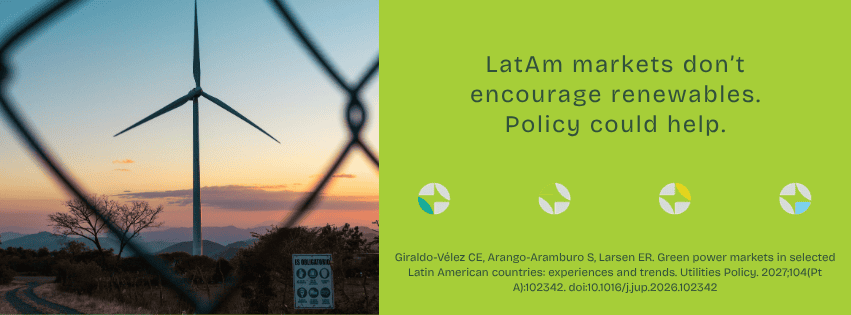 Wind turbine at sunset with a fence in the foreground, promoting renewable energy policies in Latin.